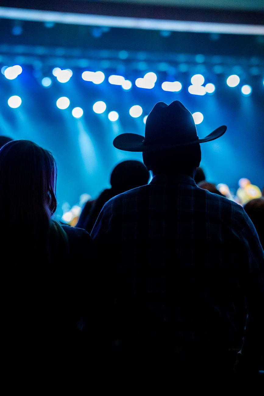 man in hat on concert